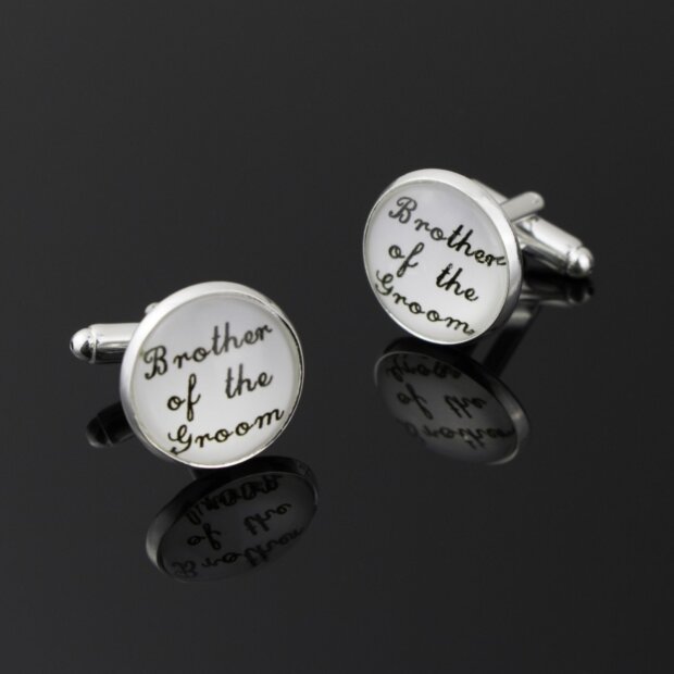 round white cufflinks with brother of the groom written in black cursive