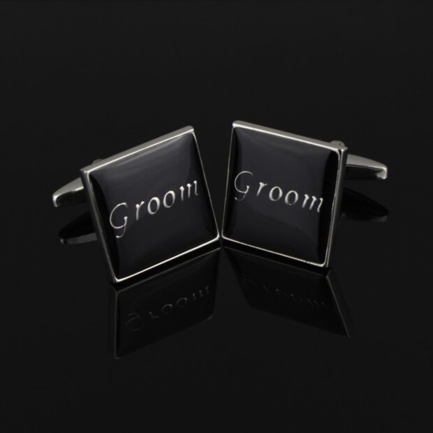 black square cufflinks with silver trim and groom written in silver