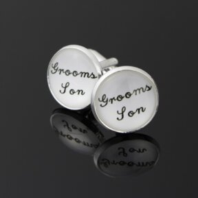round white cufflinks with grooms son written in black cursive